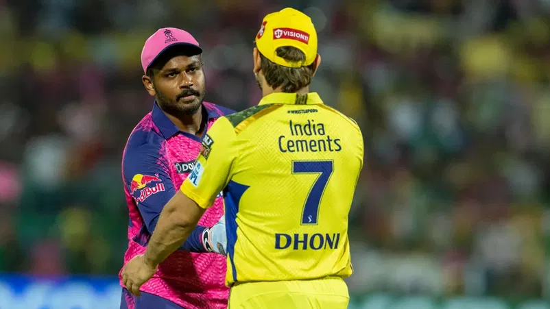 Sanju Samson and Dhoni shaking hands.