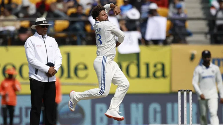 Kuldeep Yadav bowling during a Test match, delivering the ball with his left arm