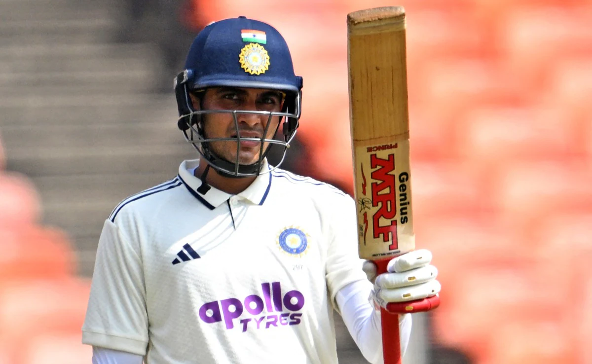 Shubman Gill showing his bat after century