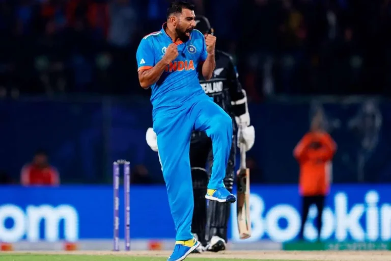 Mohammed Shami celebrates after taking a wicket for India during an international cricket match.